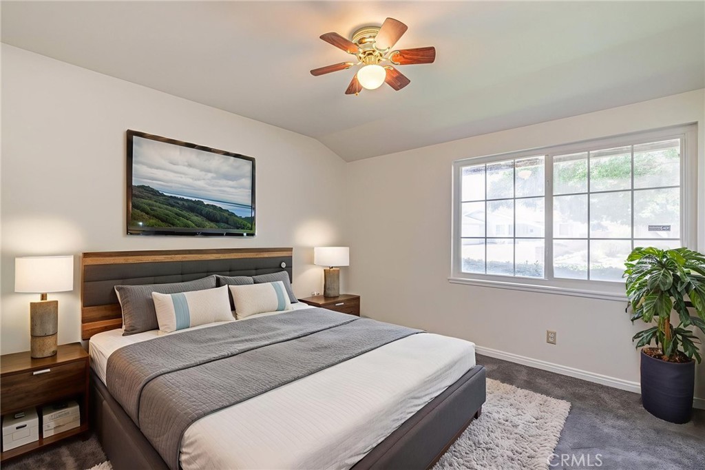 44916 18th Street West Lancaster, CA 93534 - Photo 19 of 32 a bedroom with a large bed and a window