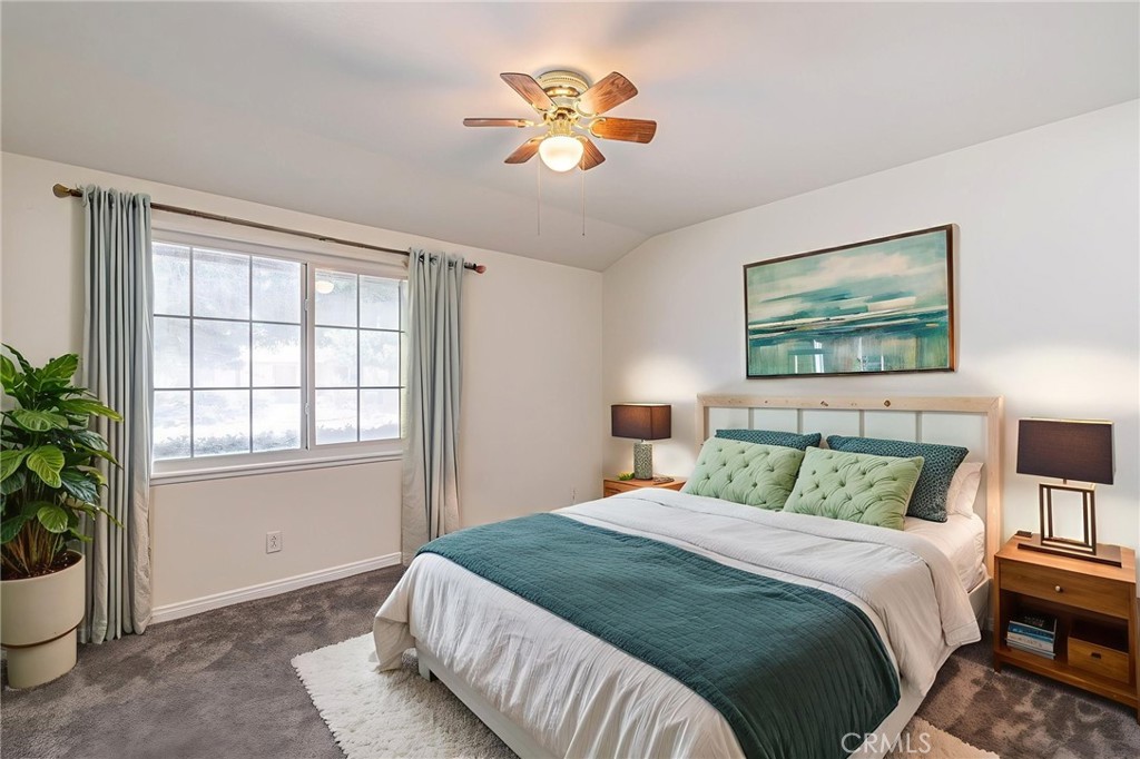 44916 18th Street West Lancaster, CA 93534 - Photo 21 of 32 a bedroom with a bed and a potted plant