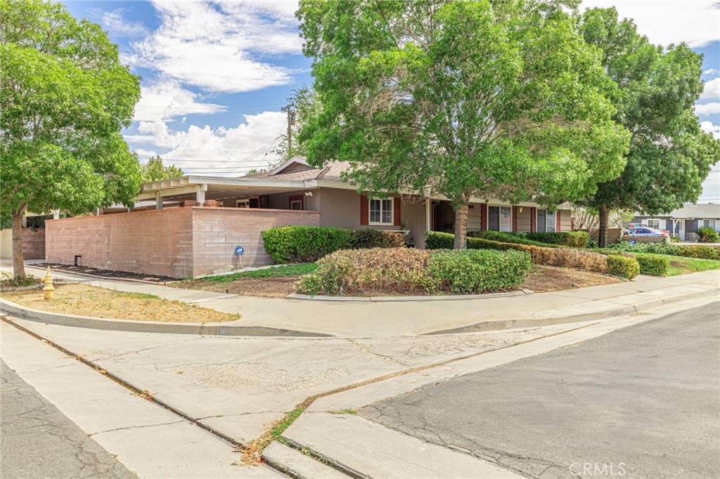 44916 18th Street West Lancaster, CA 93534 - Photo 3 of 32 front view of a house with a patio
