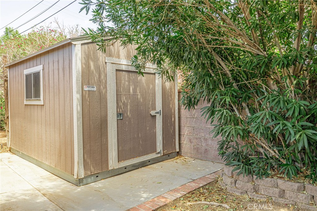 44916 18th Street West Lancaster, CA 93534 - Photo 31 of 32 a view of a small house with backyard