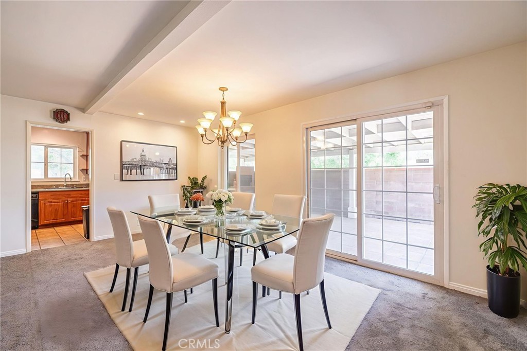 44916 18th Street West Lancaster, CA 93534 - Photo 5 of 32 a view of a dining room with furniture and chandelier