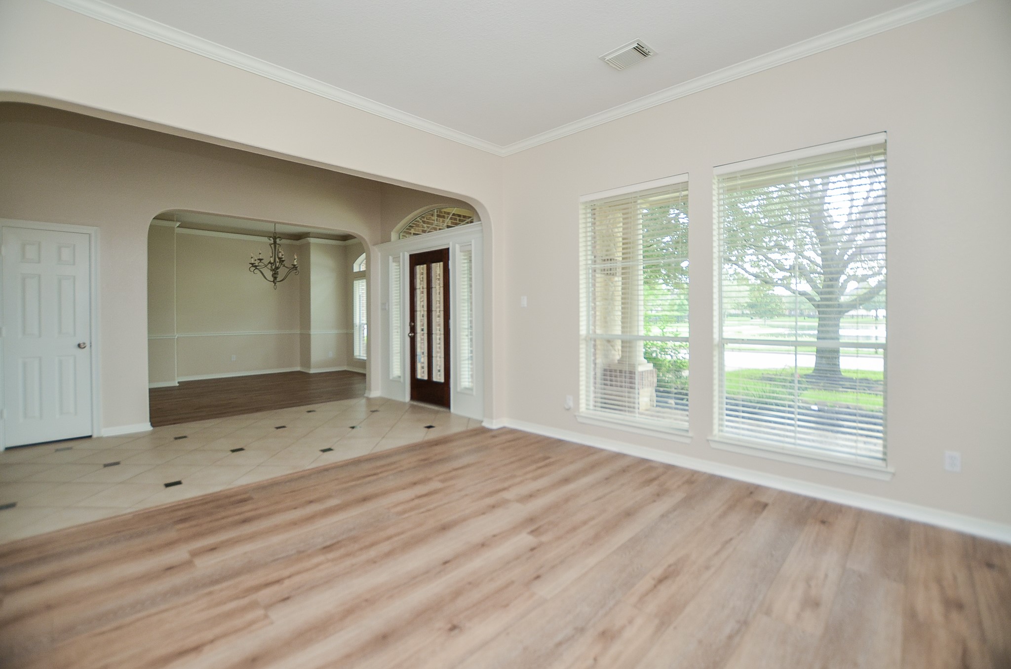 7218 Spring Run Lane Katy, TX 77494 - Photo 9 of 49 a view of a room with wooden floor and windows