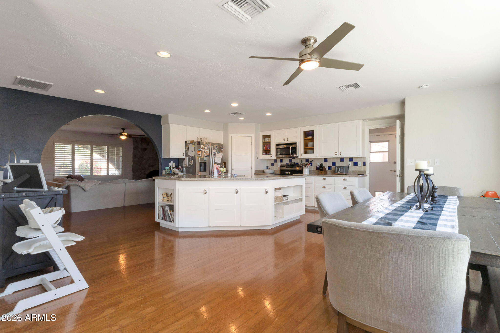 4546 North 34th Place Phoenix, AZ 85018 - Photo 10 of 29 a living room with furniture and kitchen view