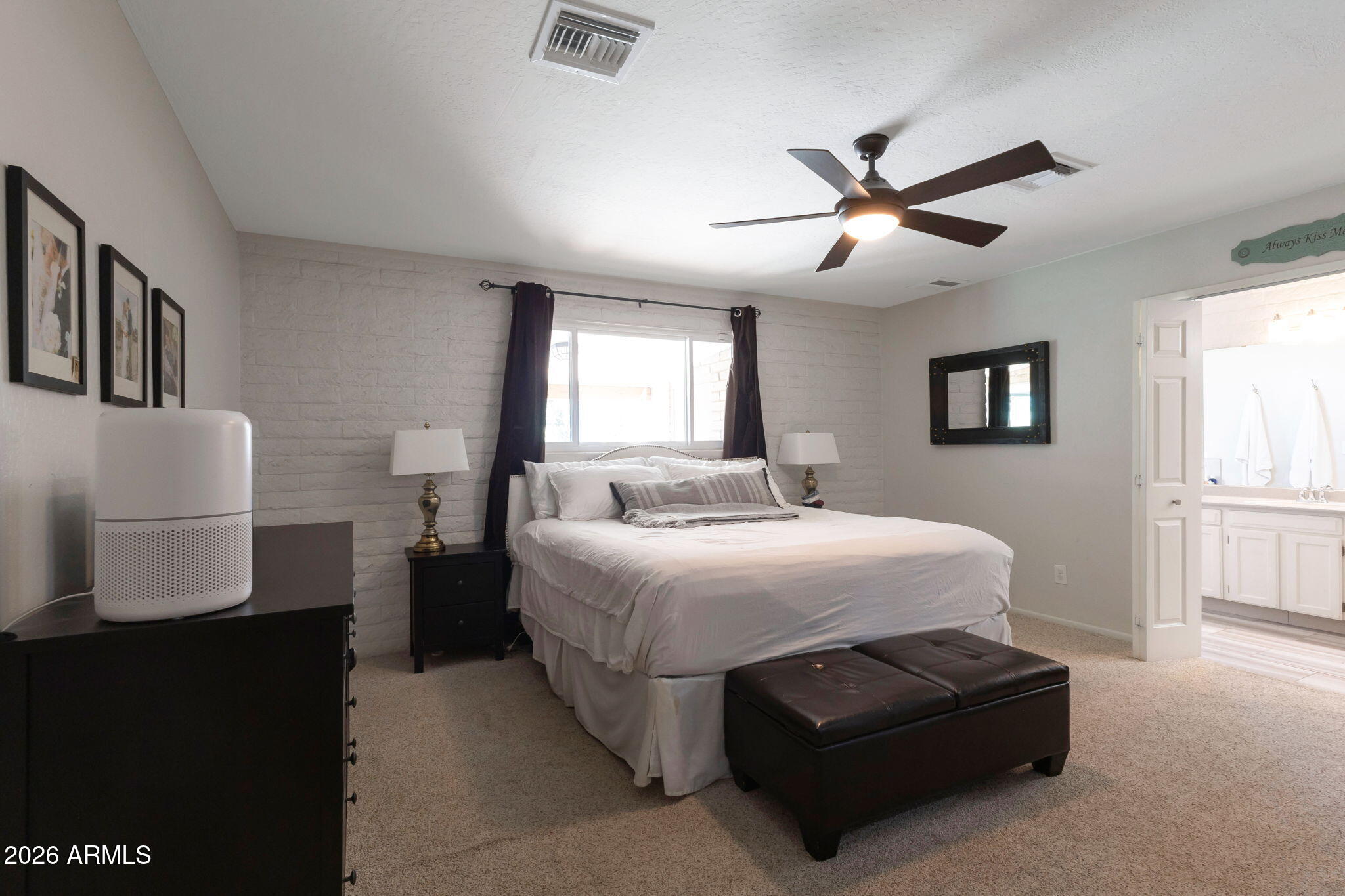 4546 North 34th Place Phoenix, AZ 85018 - Photo 13 of 29 a bedroom with a bed and window