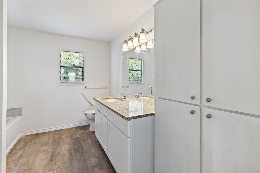 420 South Riggins Street Anna, TX 75409 - Photo 13 of 25 a bathroom with a sink and a mirror