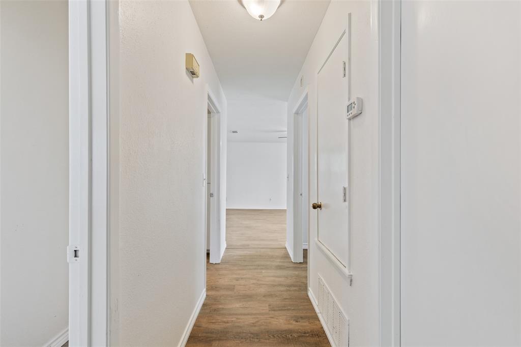 420 South Riggins Street Anna, TX 75409 - Photo 19 of 25 a view of a hallway with wooden floor