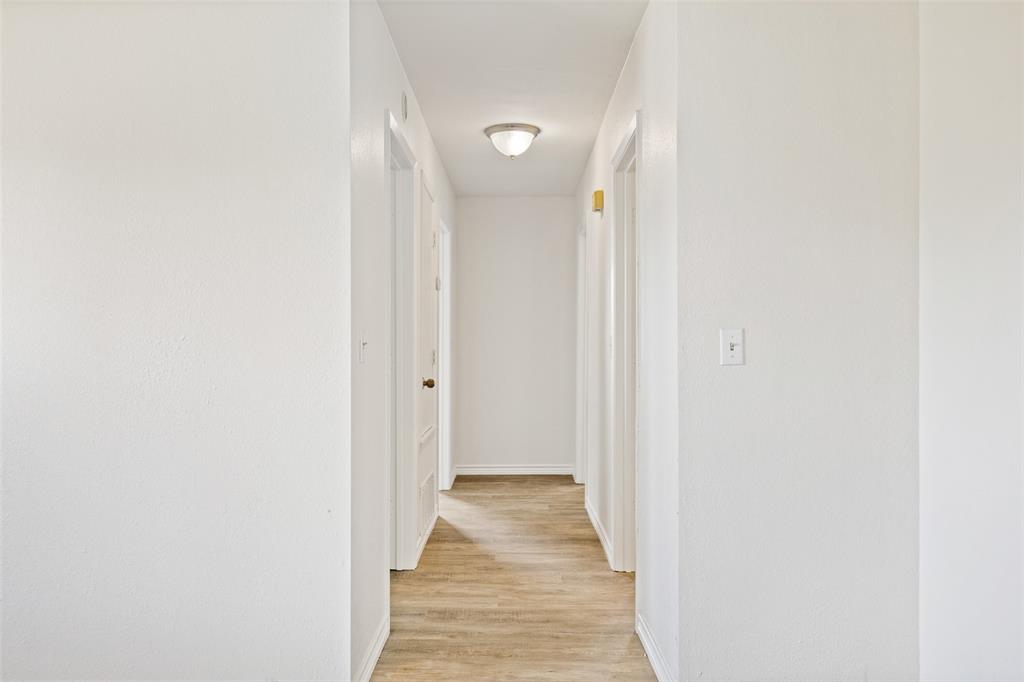 420 South Riggins Street Anna, TX 75409 - Photo 7 of 25 a view of a hallway with wooden floor