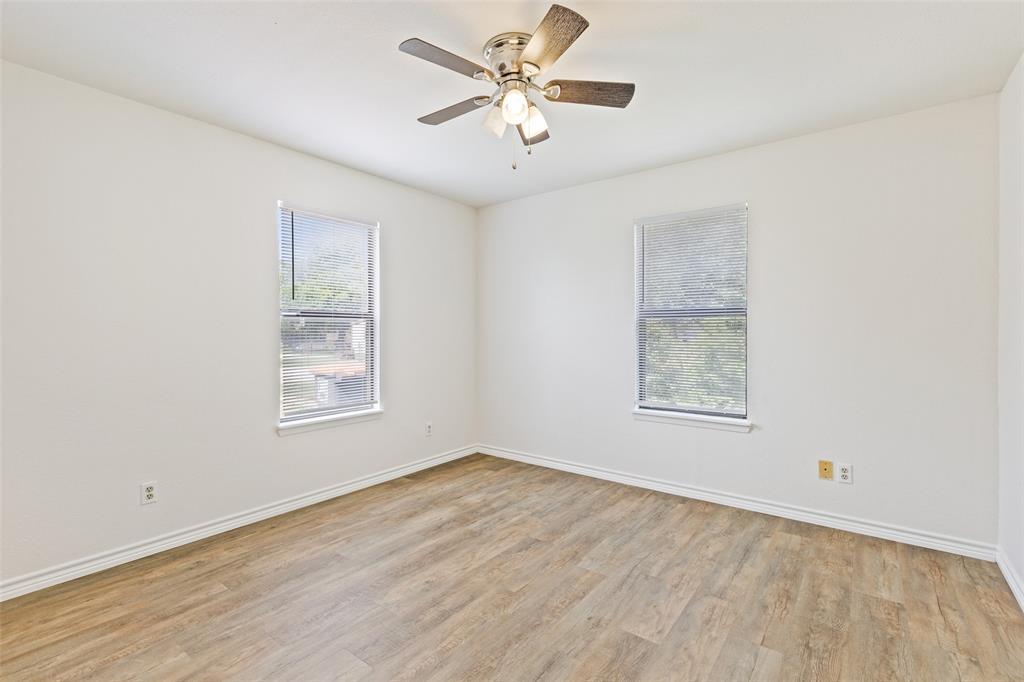 420 South Riggins Street Anna, TX 75409 - Photo 8 of 25 wooden floor in an empty room with a window