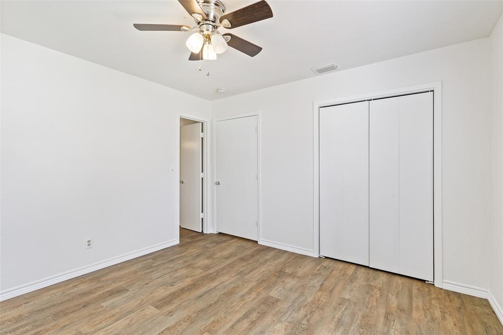 420 South Riggins Street Anna, TX 75409 - Photo 9 of 25 a view of an empty room with wooden floor