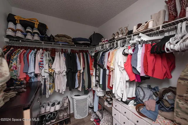 a white toilet sitting next to a shower curtain