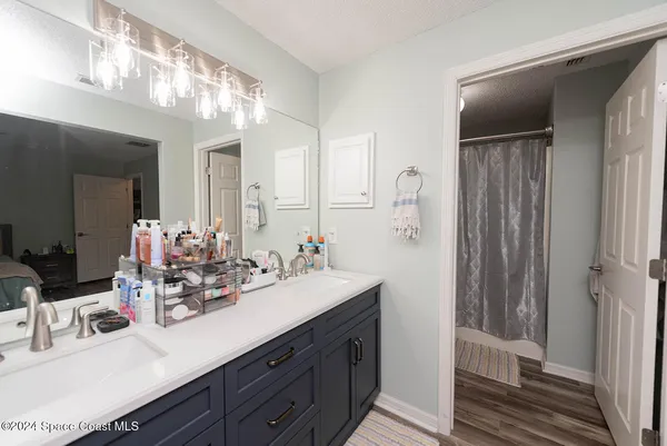 a bathroom with a sink double vanity and a mirror