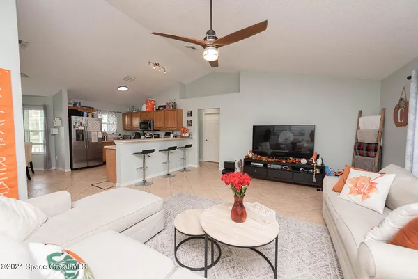 a kitchen with granite countertop stainless steel appliances and white cabinets