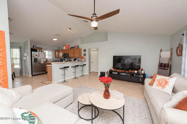 a kitchen with granite countertop stainless steel appliances and white cabinets