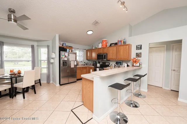 a view of a dining room with furniture window and outside view
