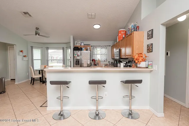 a front view of house with yard and trees