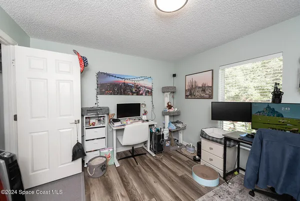 a workspace with furniture and a window