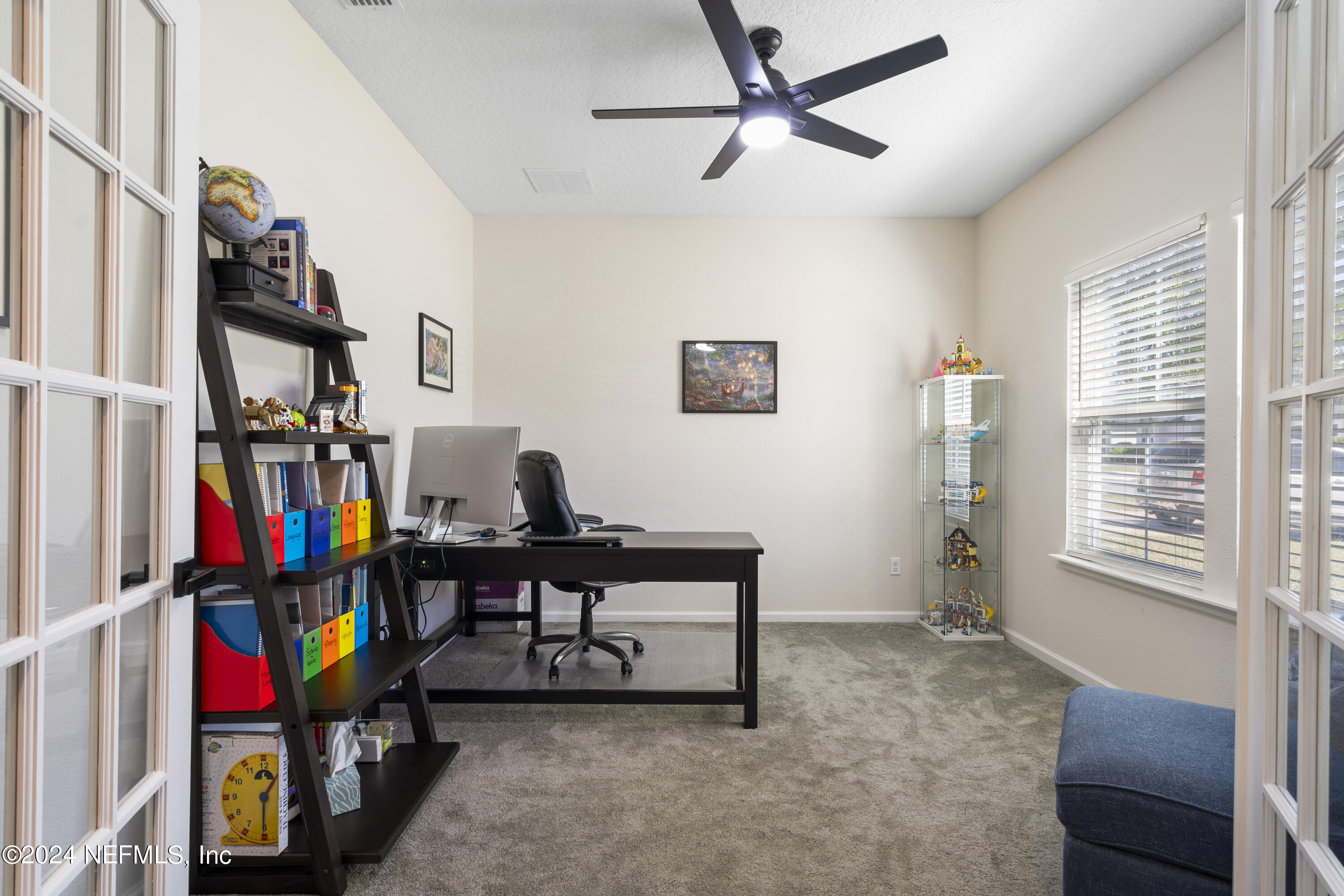 4060 Arbor Mill Circle Orange Park, FL 32065 - Photo 11 of 52 a view of a workspace with furniture and a window
