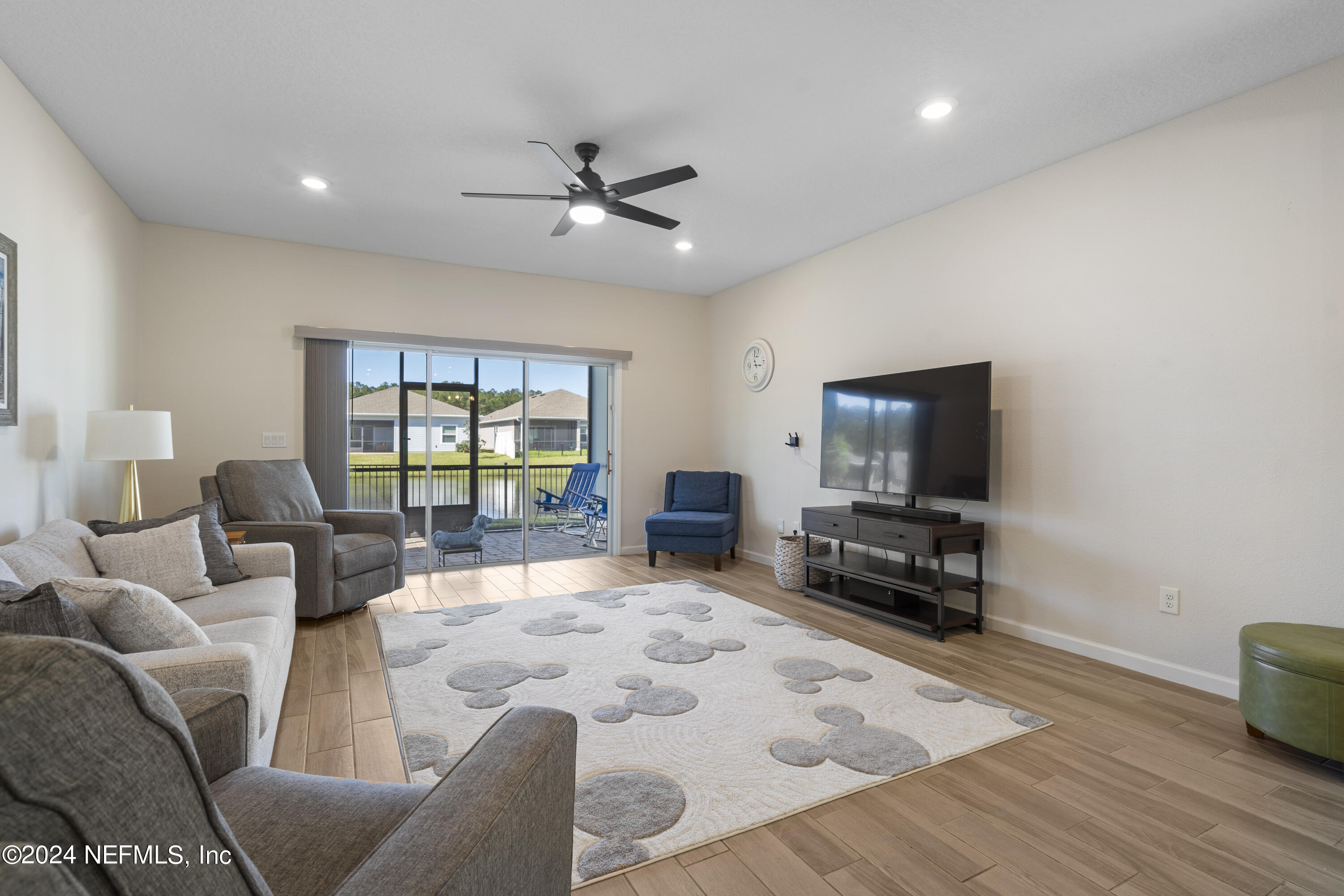 4060 Arbor Mill Circle Orange Park, FL 32065 - Photo 20 of 52 a living room with furniture and a flat screen tv