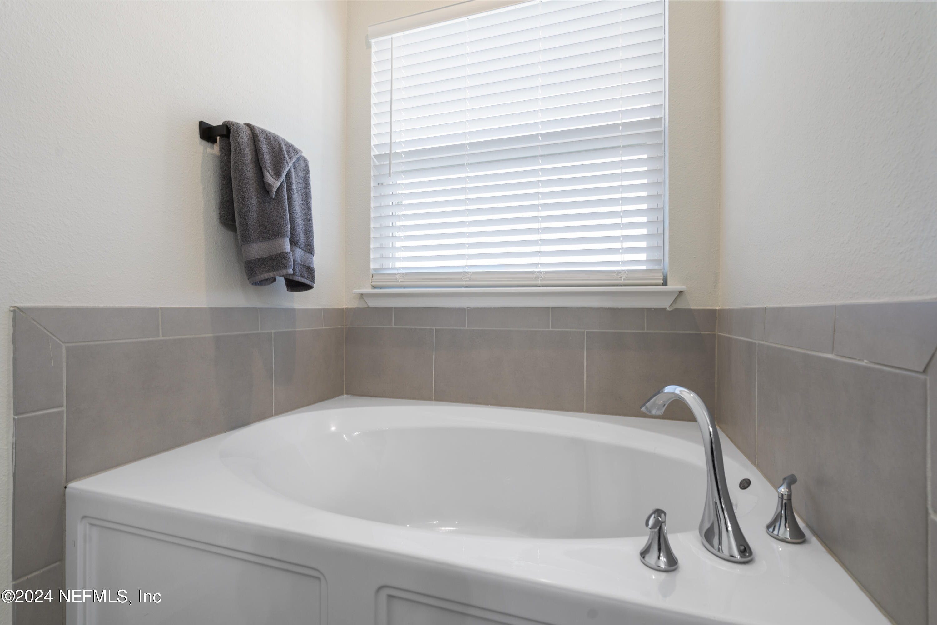 4060 Arbor Mill Circle Orange Park, FL 32065 - Photo 27 of 52 a white bath tub sitting in a bathroom