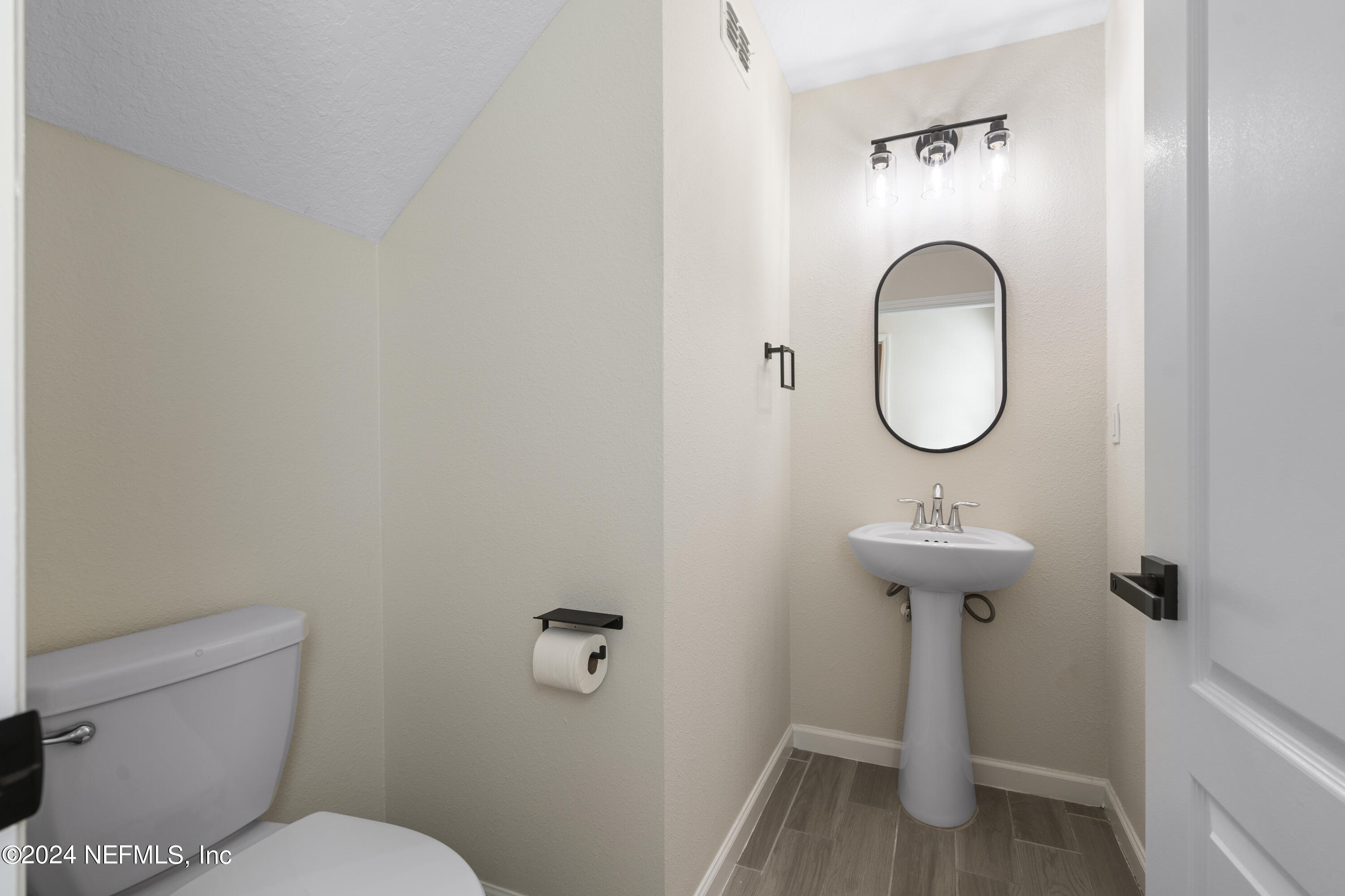 4060 Arbor Mill Circle Orange Park, FL 32065 - Photo 29 of 52 a bathroom with a sink toilet and a mirror