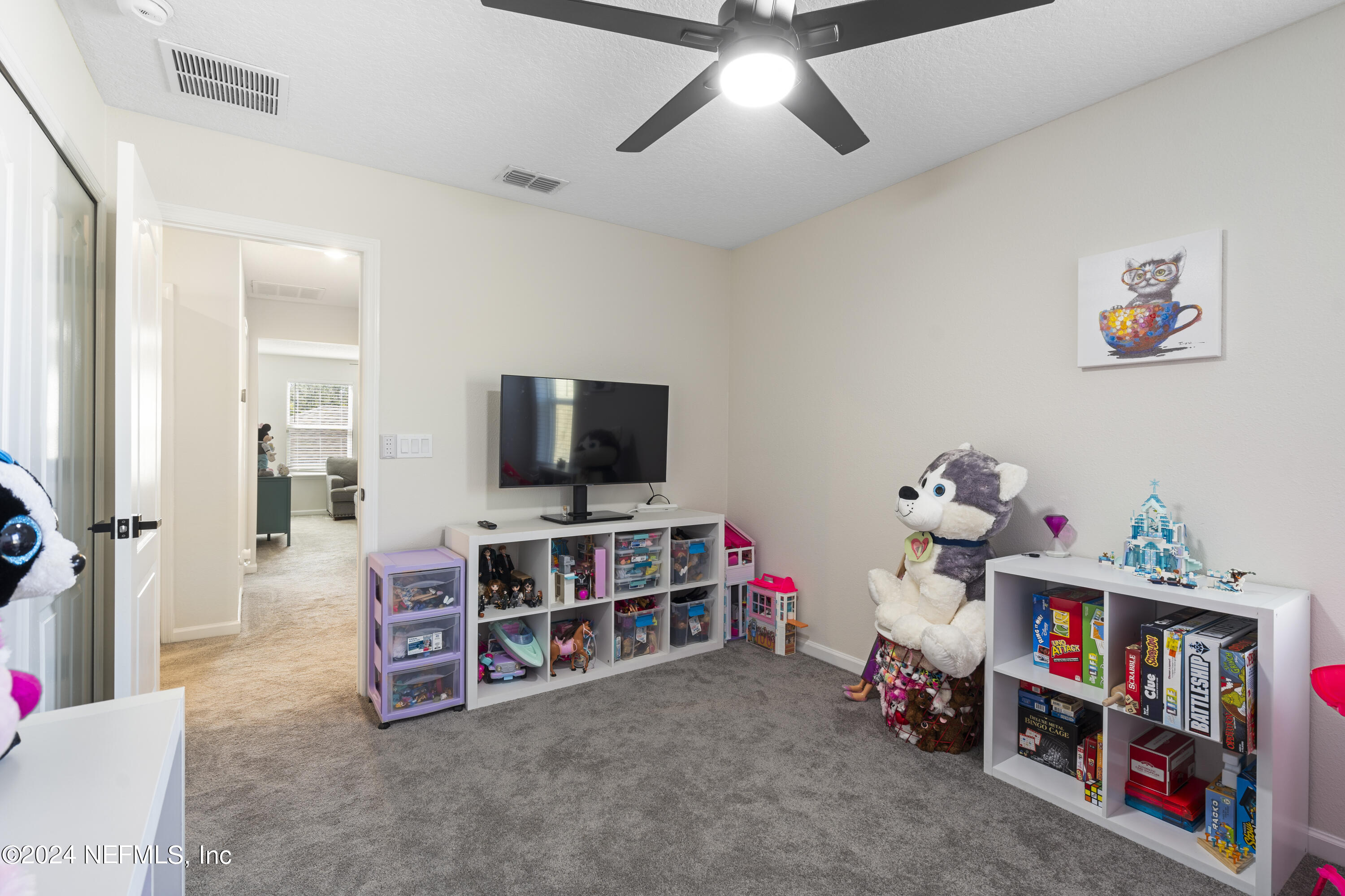 4060 Arbor Mill Circle Orange Park, FL 32065 - Photo 35 of 52 a living room with furniture and a flat screen tv