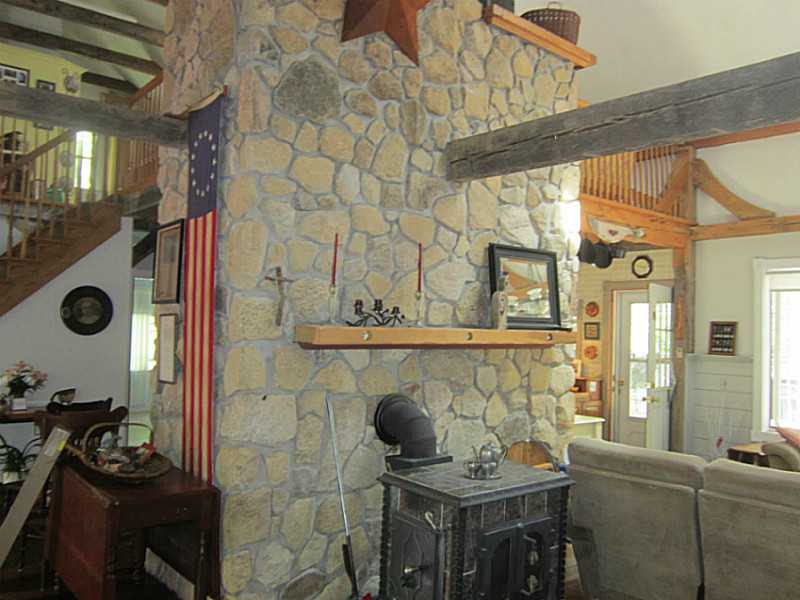 188 Lawton Foster Road North Hopkinton, RI 02832 - Photo 9 of 25 Other. floor to ceiling fieldstone fireplace with soapstone wood stove