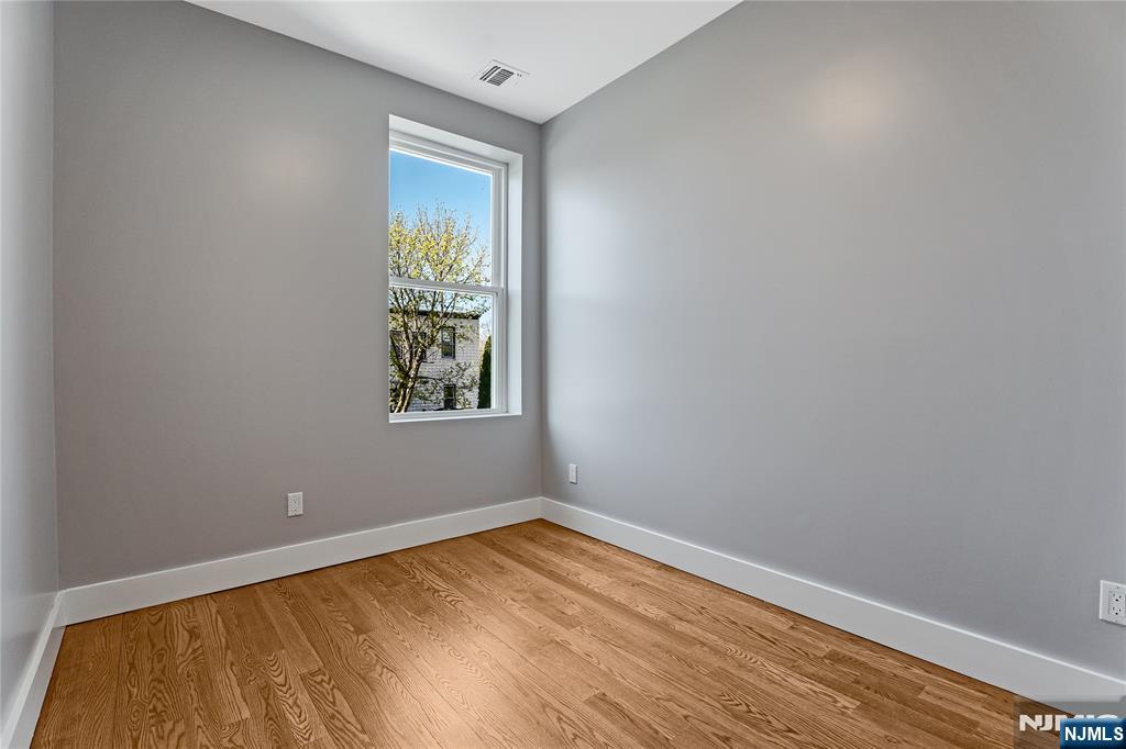 191 Franklin Street Secaucus, NJ 07094 - Photo 27 of 34 a view of empty room with wooden floor