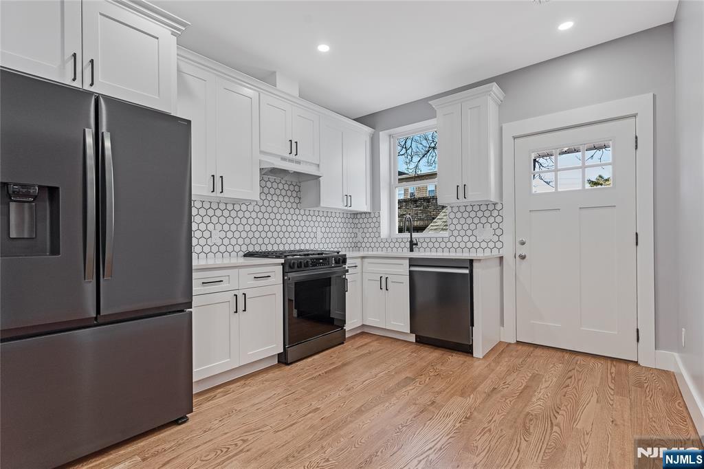 191 Franklin Street Secaucus, NJ 07094 - Photo 4 of 34 a kitchen with a stove top oven and refrigerator