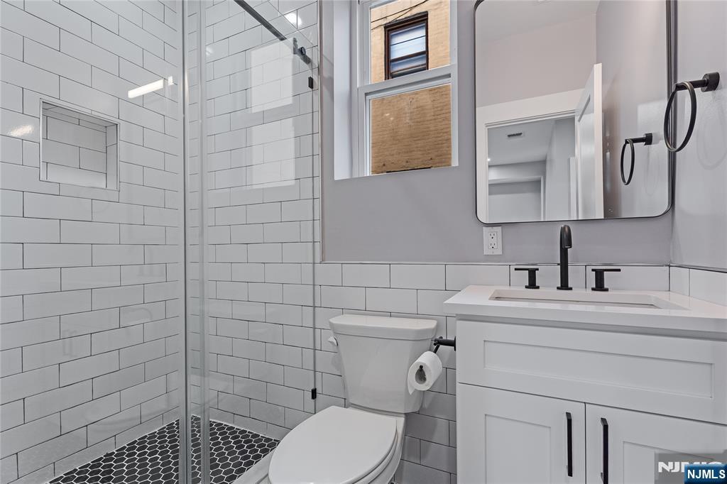 191 Franklin Street Secaucus, NJ 07094 - Photo 5 of 34 a bathroom with a sink toilet and shower