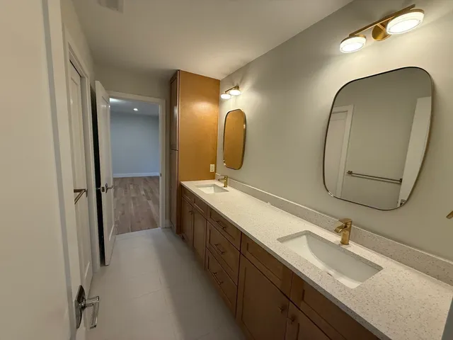 a bathroom with a shower and a sink