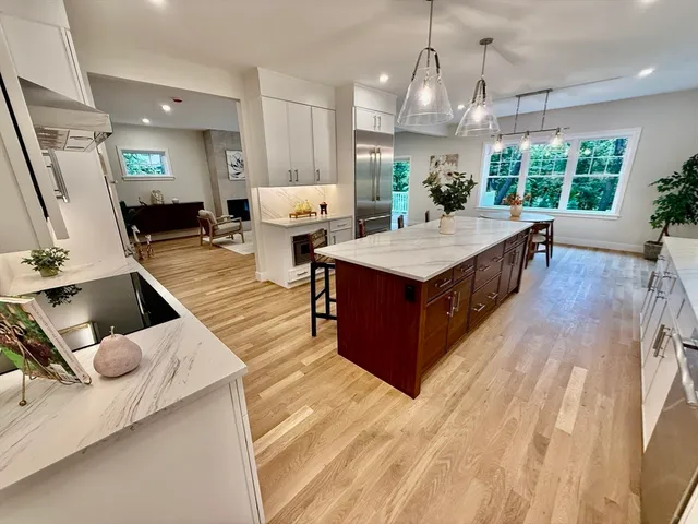 a dining room with furniture window and wooden floor