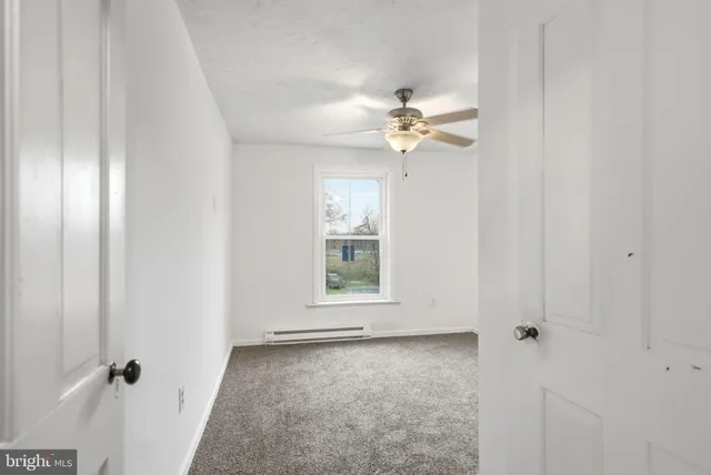 a view of an empty room and window