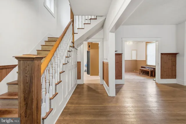 a view of a hallway view with staircase