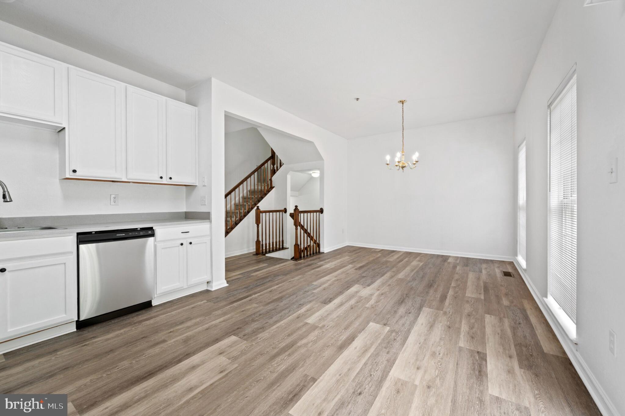 29 Pier Point Drive Millville, DE 19967 - Photo 15 of 36 a view of a kitchen with wooden floor and electronic appliances