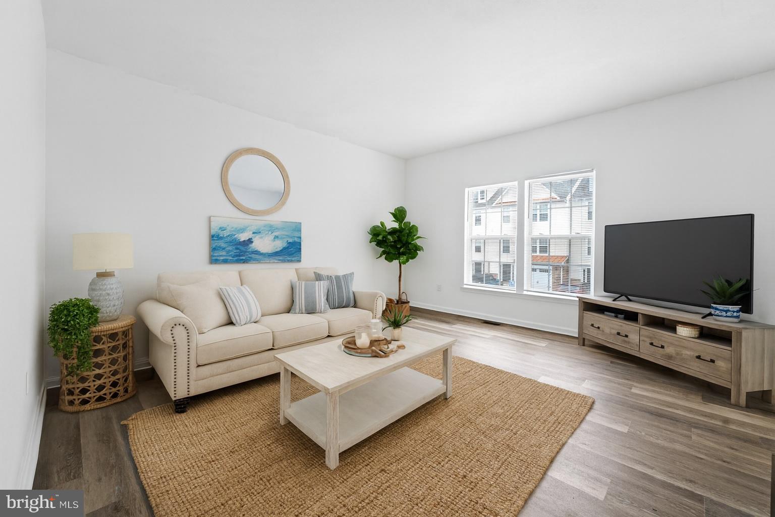 29 Pier Point Drive Millville, DE 19967 - Photo 17 of 36 a living room with furniture and a flat screen tv