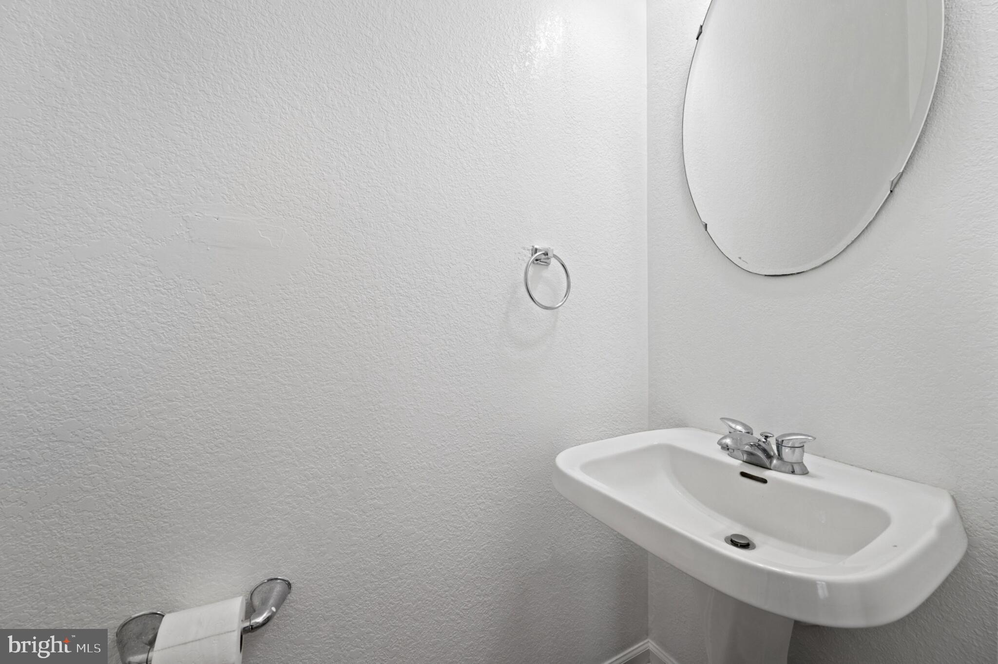 29 Pier Point Drive Millville, DE 19967 - Photo 19 of 36 a bathroom with a sink and a mirror