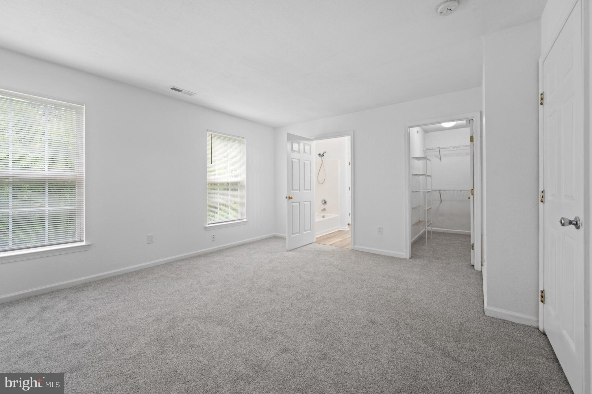 29 Pier Point Drive Millville, DE 19967 - Photo 27 of 36 an empty room with windows and closet