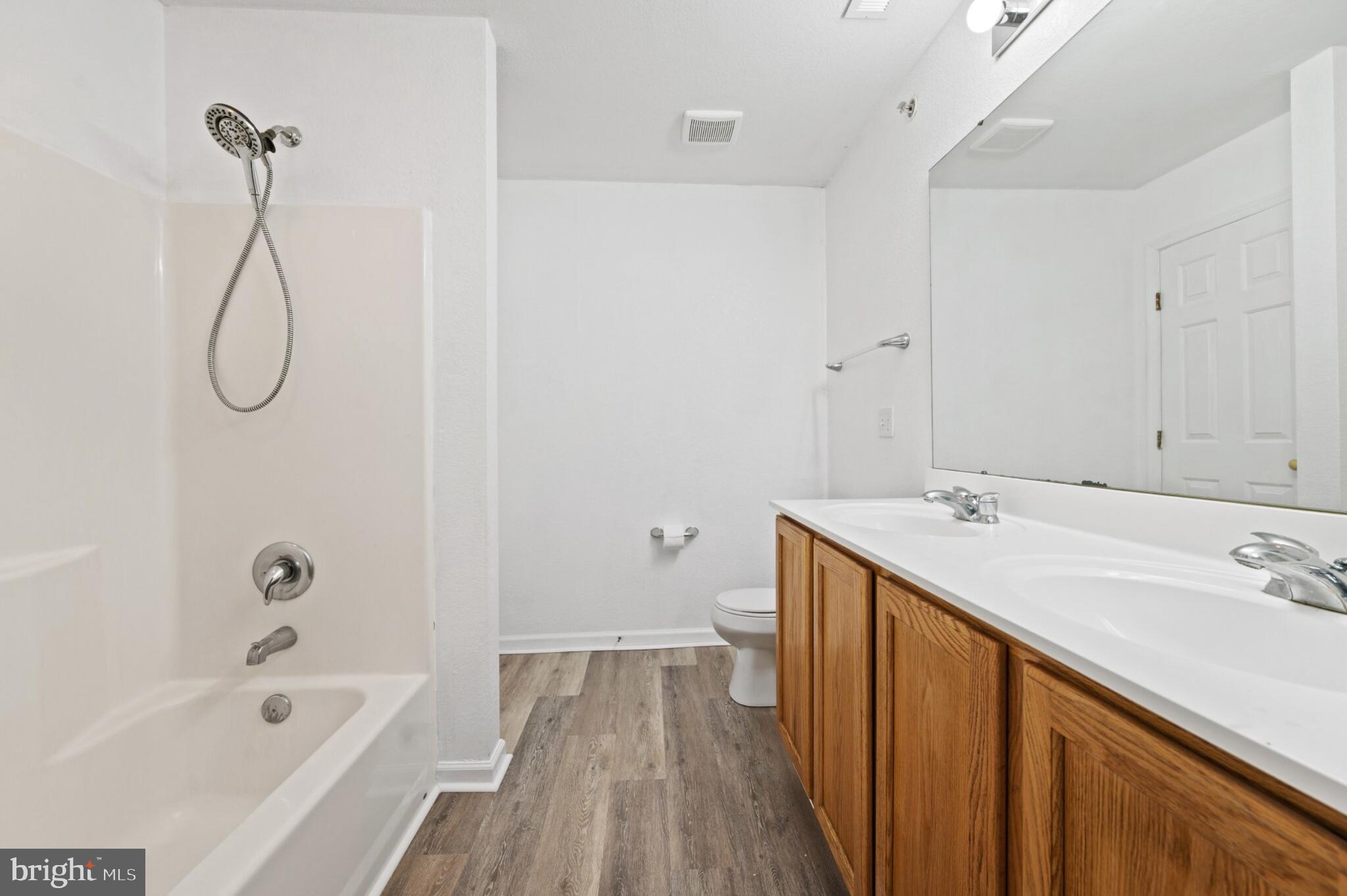 29 Pier Point Drive Millville, DE 19967 - Photo 28 of 36 a bathroom with a sink a vanity and shower