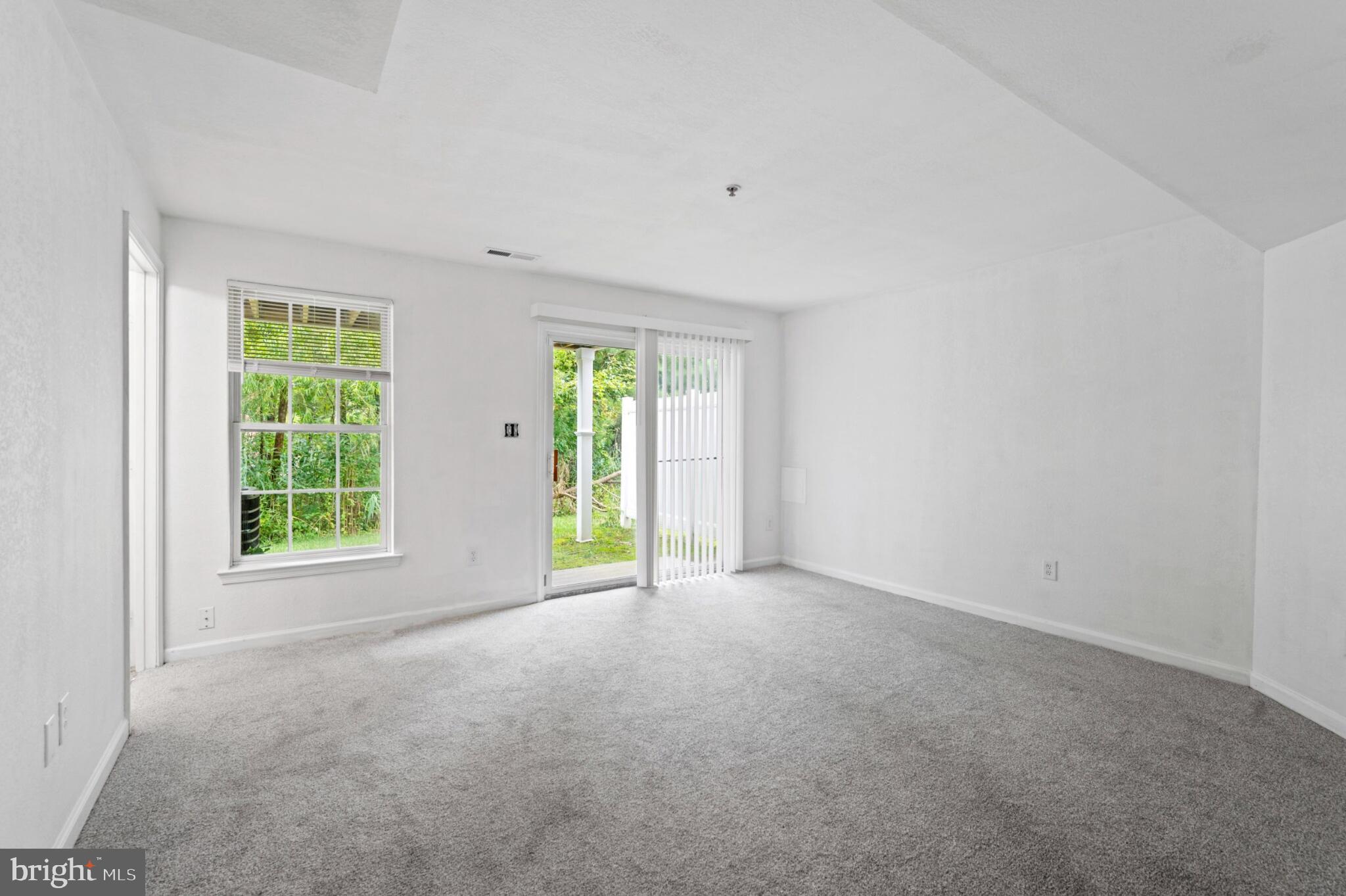 29 Pier Point Drive Millville, DE 19967 - Photo 9 of 36 an empty room with windows