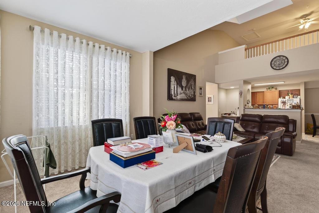 8550 Touchton Road, Unit 2221 Jacksonville, FL 32216 - Photo 12 of 53 a living room with furniture and a window