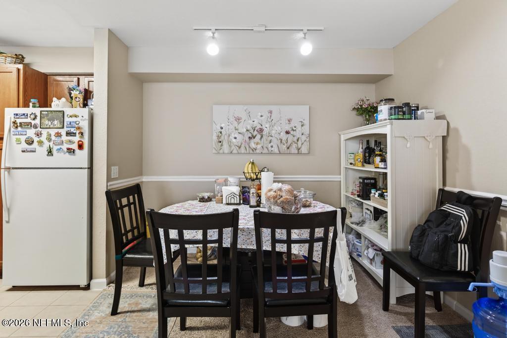 8550 Touchton Road, Unit 2221 Jacksonville, FL 32216 - Photo 13 of 53 a view of a dining room with furniture