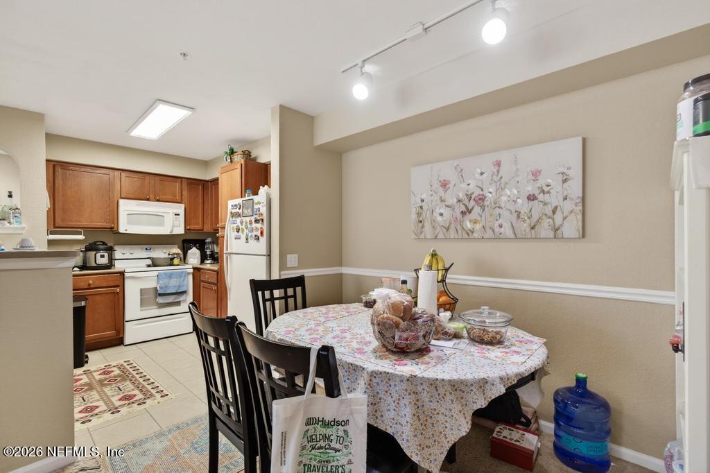 8550 Touchton Road, Unit 2221 Jacksonville, FL 32216 - Photo 14 of 53 a view of a dining room with furniture