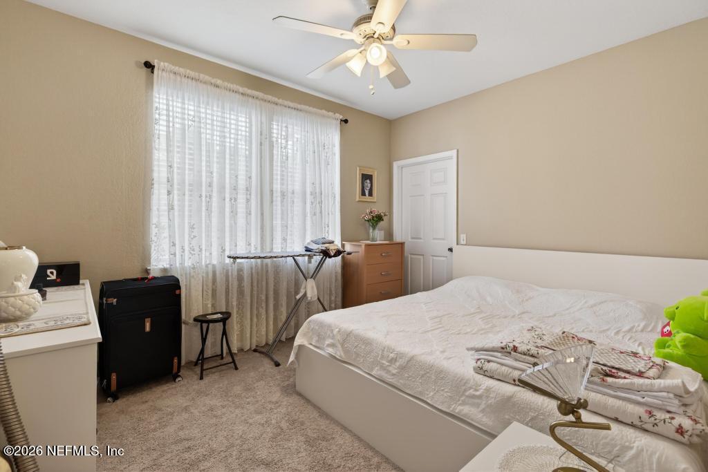 8550 Touchton Road, Unit 2221 Jacksonville, FL 32216 - Photo 18 of 53 a bedroom with bed and window