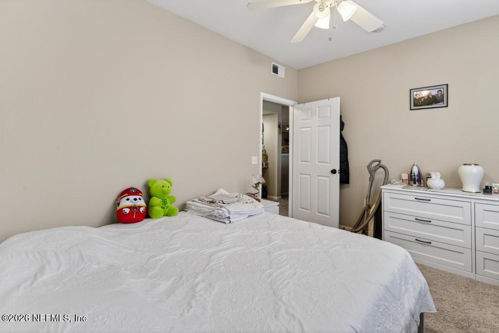 8550 Touchton Road, Unit 2221 Jacksonville, FL 32216 - Photo 19 of 53 a bedroom with a bed and a closet