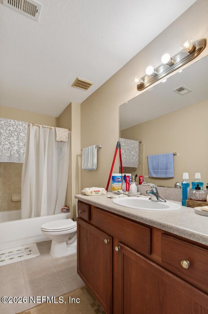 8550 Touchton Road, Unit 2221 Jacksonville, FL 32216 - Photo 21 of 53 a bathroom with a sink vanity mirror and toilet
