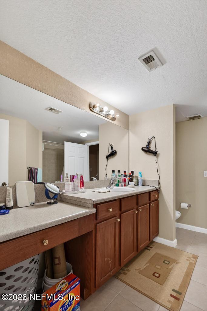 8550 Touchton Road, Unit 2221 Jacksonville, FL 32216 - Photo 29 of 53 a room with furniture and mirror