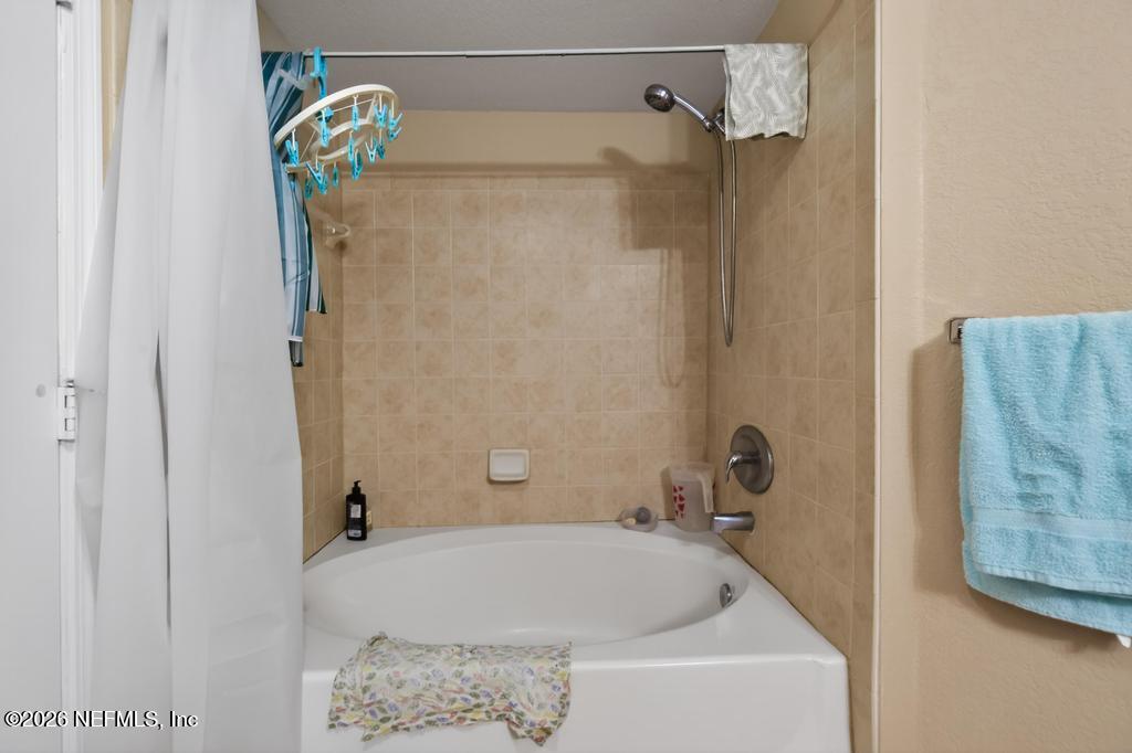 8550 Touchton Road, Unit 2221 Jacksonville, FL 32216 - Photo 31 of 53 a bathroom with a tub