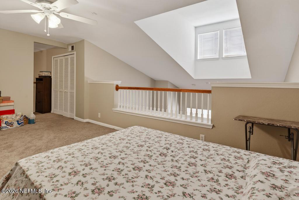 8550 Touchton Road, Unit 2221 Jacksonville, FL 32216 - Photo 36 of 53 a bedroom with a bed and a dresser