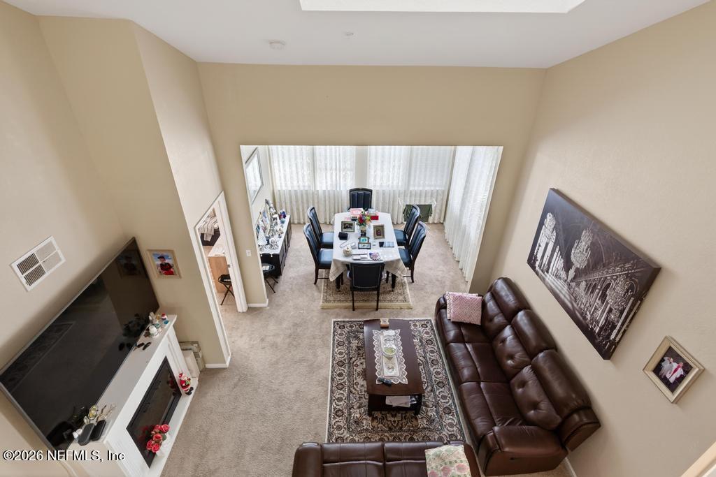 8550 Touchton Road, Unit 2221 Jacksonville, FL 32216 - Photo 38 of 53 a living room with furniture and a flat screen tv