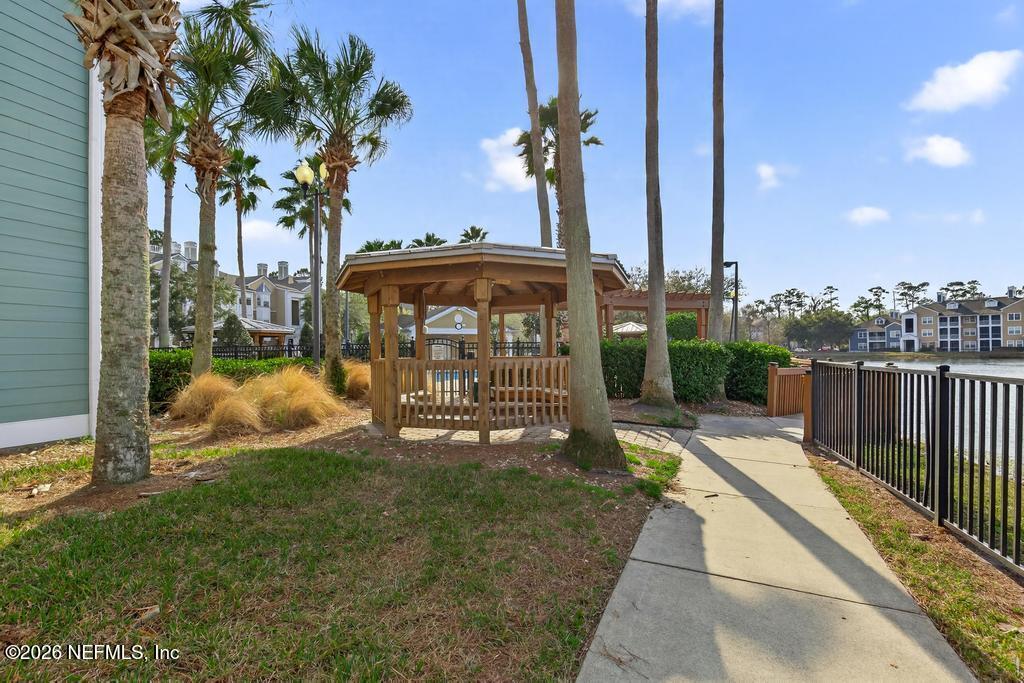 8550 Touchton Road, Unit 2221 Jacksonville, FL 32216 - Photo 40 of 53 a view of a house with a yard